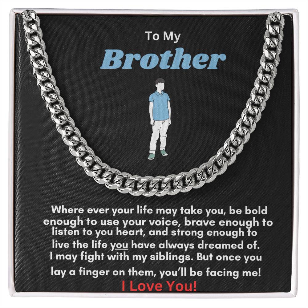 A Cuban link chain necklace with an overlay of silver or gold color, featuring an adjustable length and a parrot clasp, packaged in a black box with a textured background.